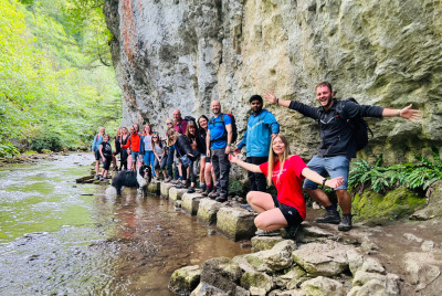 Leading a fantastic group walk at Chee Dale Stepping Stones, a must-see in the Peak District.