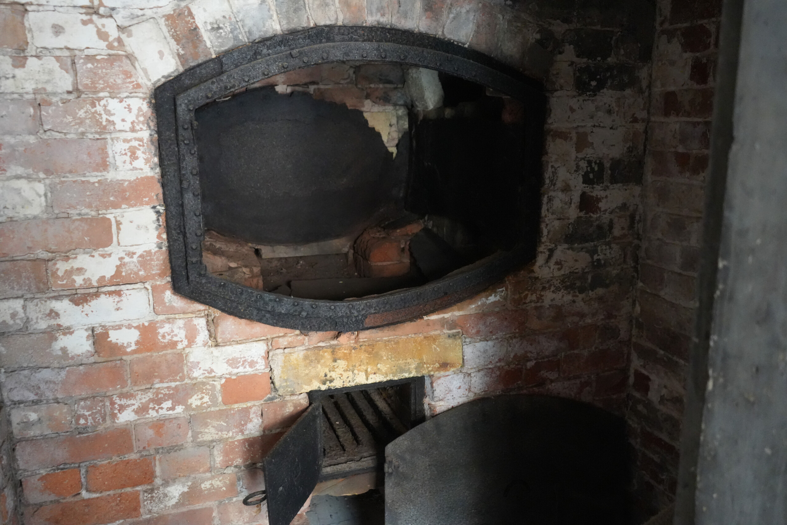 Close Up Of Historic Brick And Iron Oven Inside The Bake House Southwell Nottinghamshire England Bake House oven at the Workhouse in Southwell