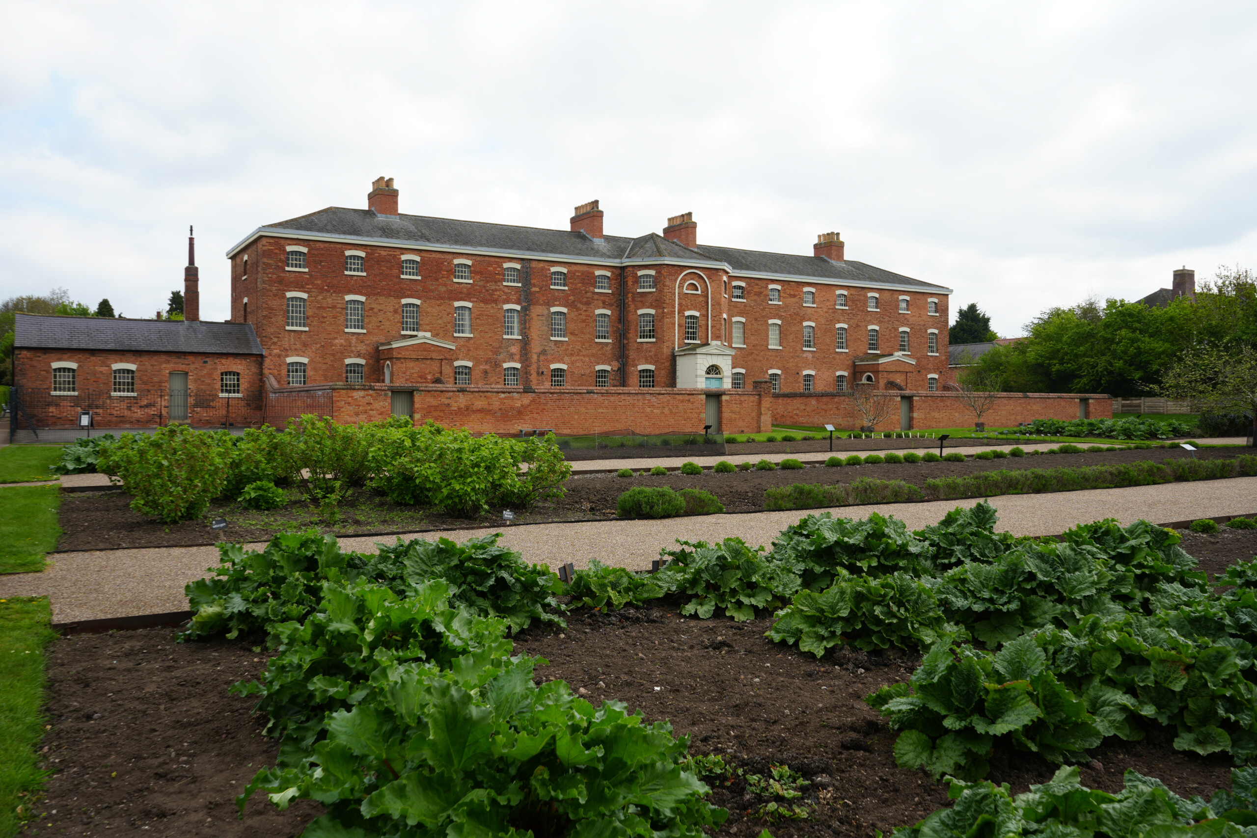 Vegetable Patch Outside Historic Red Brick Workhouse Building Southwell Nottinghamshire England Southwell Workhouse With Vegetable Patch In The Foreground