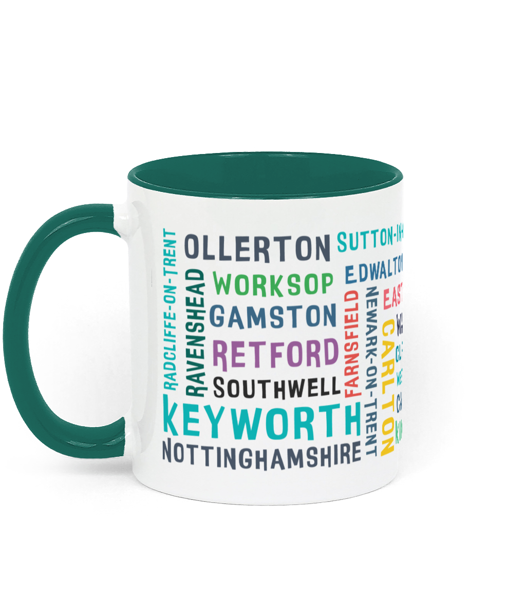 A white ceramic mug with a green handle and rim, featuring colourful text listing 30 Nottinghamshire places such as Keyworth, Retford, Southwell, Worksop, and Radcliffe-on-Trent.