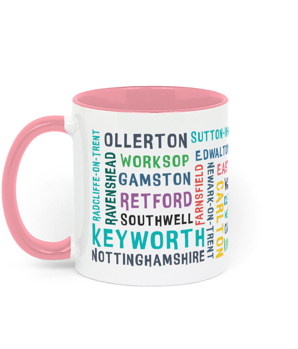 A white ceramic mug with a pink handle and rim, featuring colourful text listing 30 Nottinghamshire places such as Keyworth, Retford, Southwell, Worksop, and Radcliffe-on-Trent.