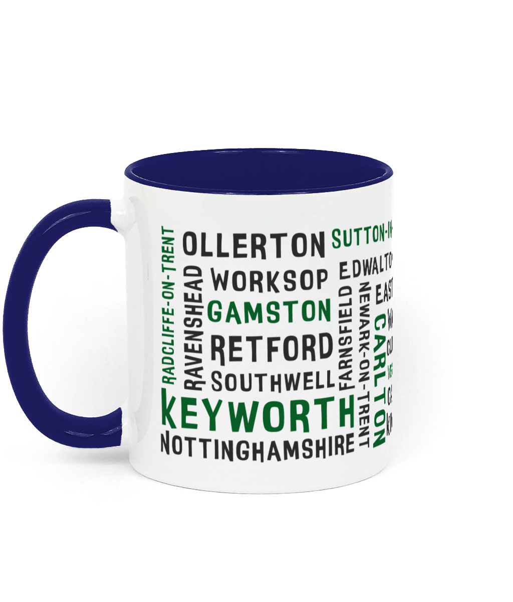 A white ceramic mug with a blue handle and inner, featuring black and green text listing 30 Nottinghamshire places such as Keyworth, Retford, Gamston, Ravenshead, and Southwell. The handle and inner colour can be customised.